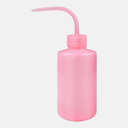 Pink plastic squeeze bottle for washing and rinsing eyelash extensions