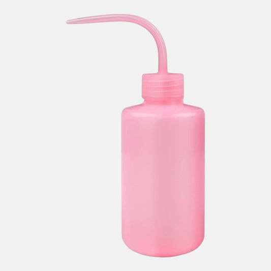 Pink plastic squeeze bottle for washing and rinsing eyelash extensions