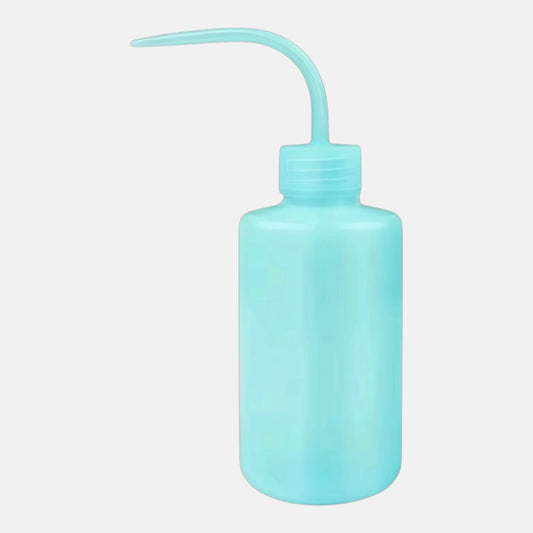 Turquoise plastic squeeze bottle for washing and rinsing eyelash extensions