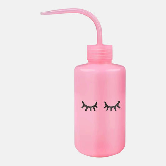 Pink squeeze bottle with eyelash logo for eyelash extensions with precision nozzle and eyelash design, ideal for lash cleanser, saline, and rinsing solutions
