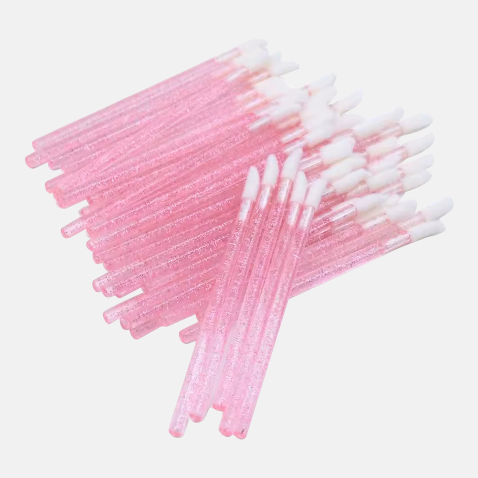 Pink disposable lint-free lip gloss applicators for eyelash extensions and beauty applications