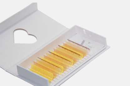 Golden Hour 0.05mm Colored Lash Extensions featuring yellow, honey, and cream lashes for volume, hybrid, and creative lash designs.
