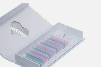 Cotton Candy Skies 0.05mm Colored Lash Extensions featuring pastel pink, blue, mint, and lavender lashes for volume, hybrid, and creative lash designs.