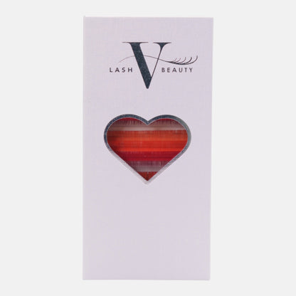 Sunset Glow colored lash extension tray featuring vibrant red and orange shades for bold lash sets and fiery lash artistry.